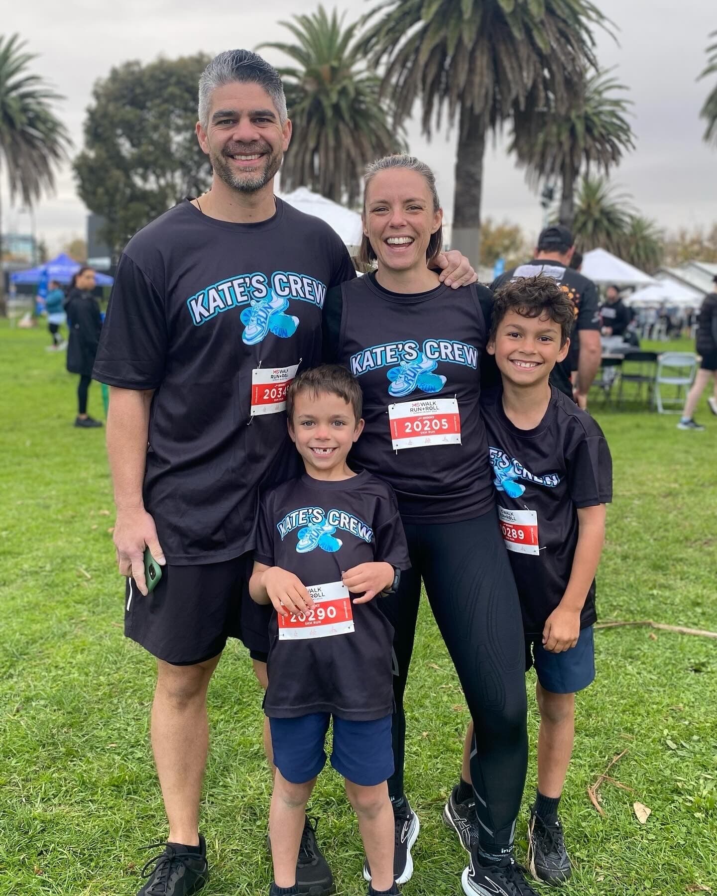 Kate and her husband and two children wearing "Kate's Crew" t-shirts
