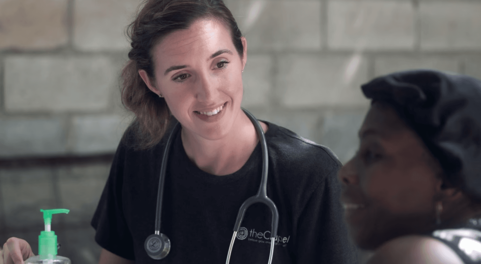 Doctor with patient outside