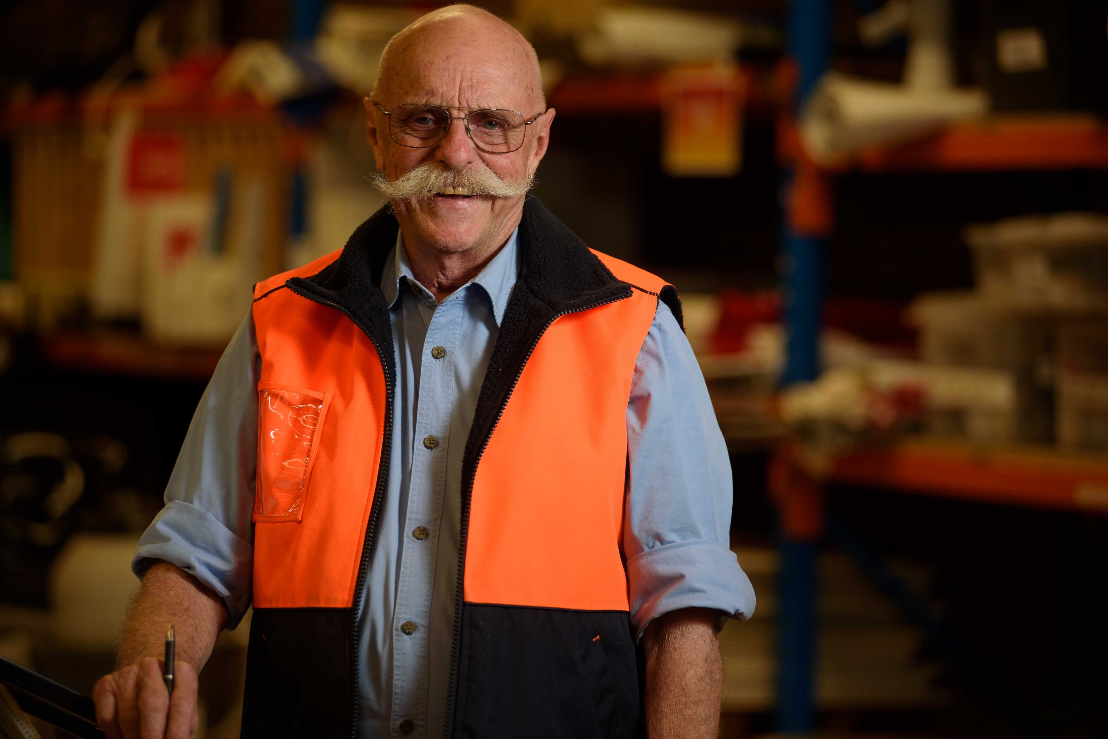 volunteer wearing an orange vest