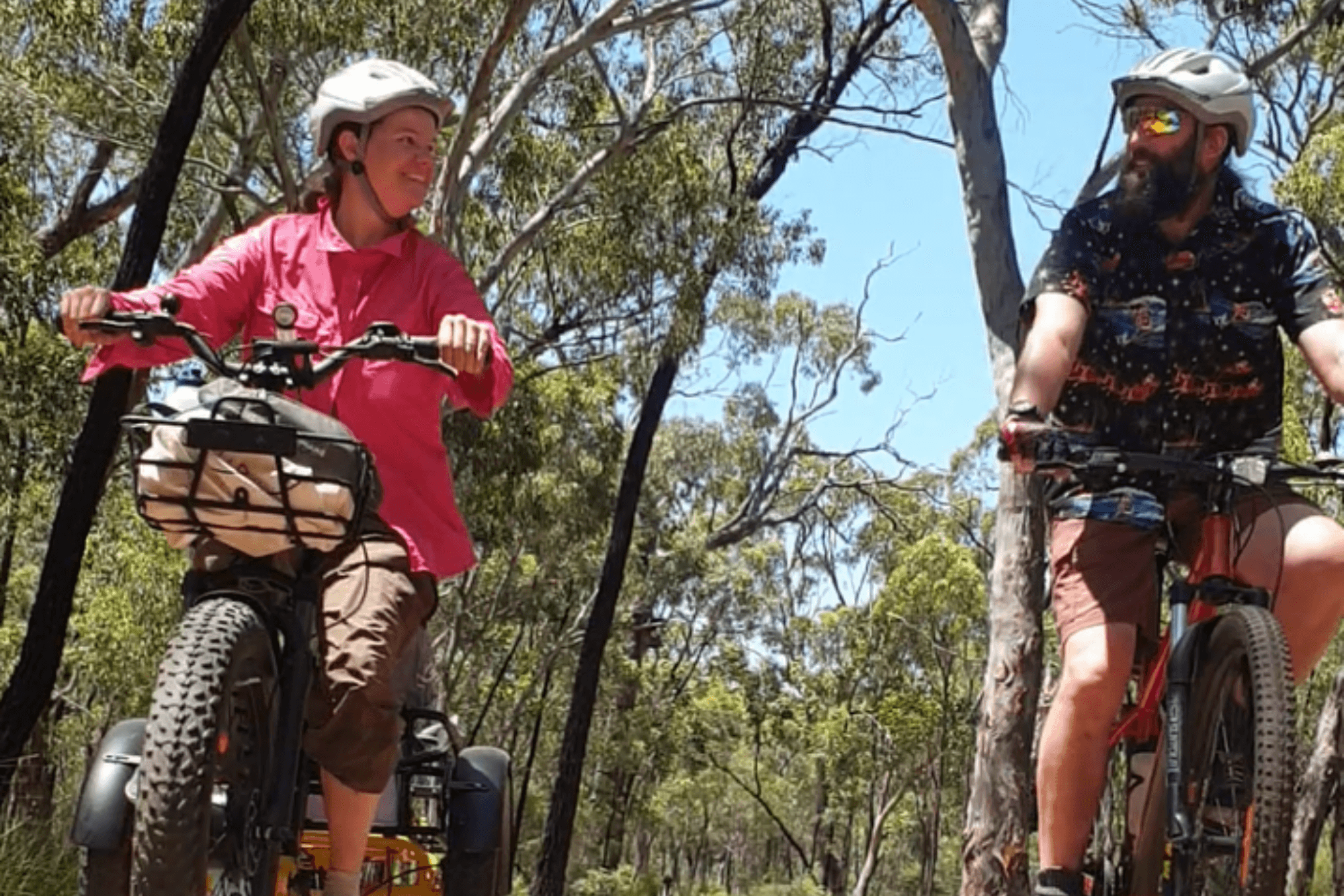 A man and a woman riding bicycle's side by side.