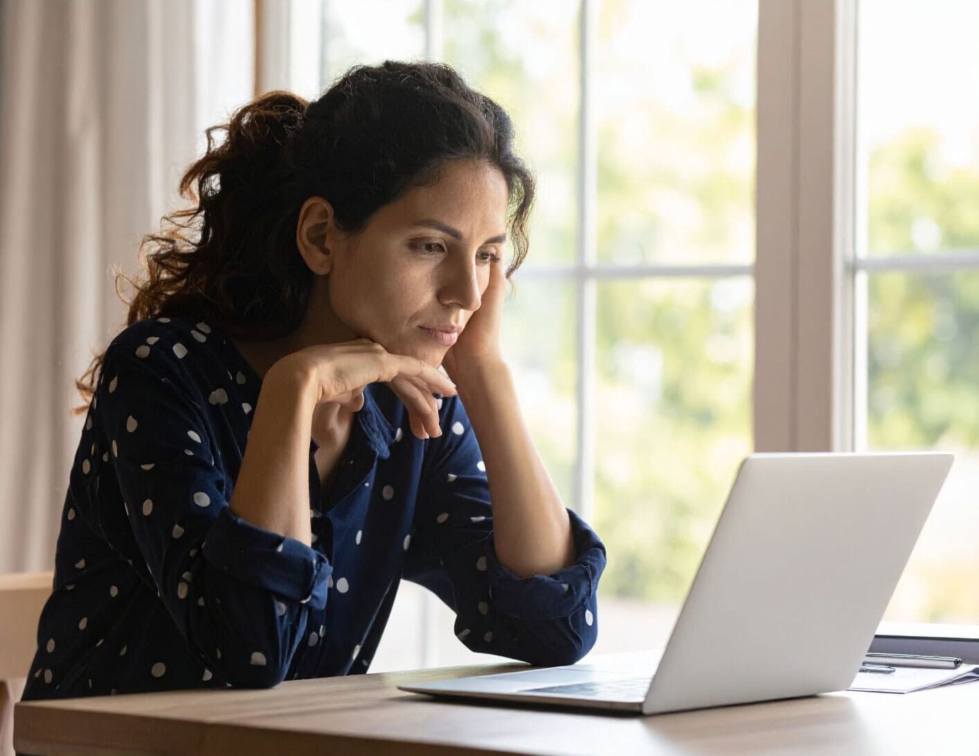 Woman using laptop for information