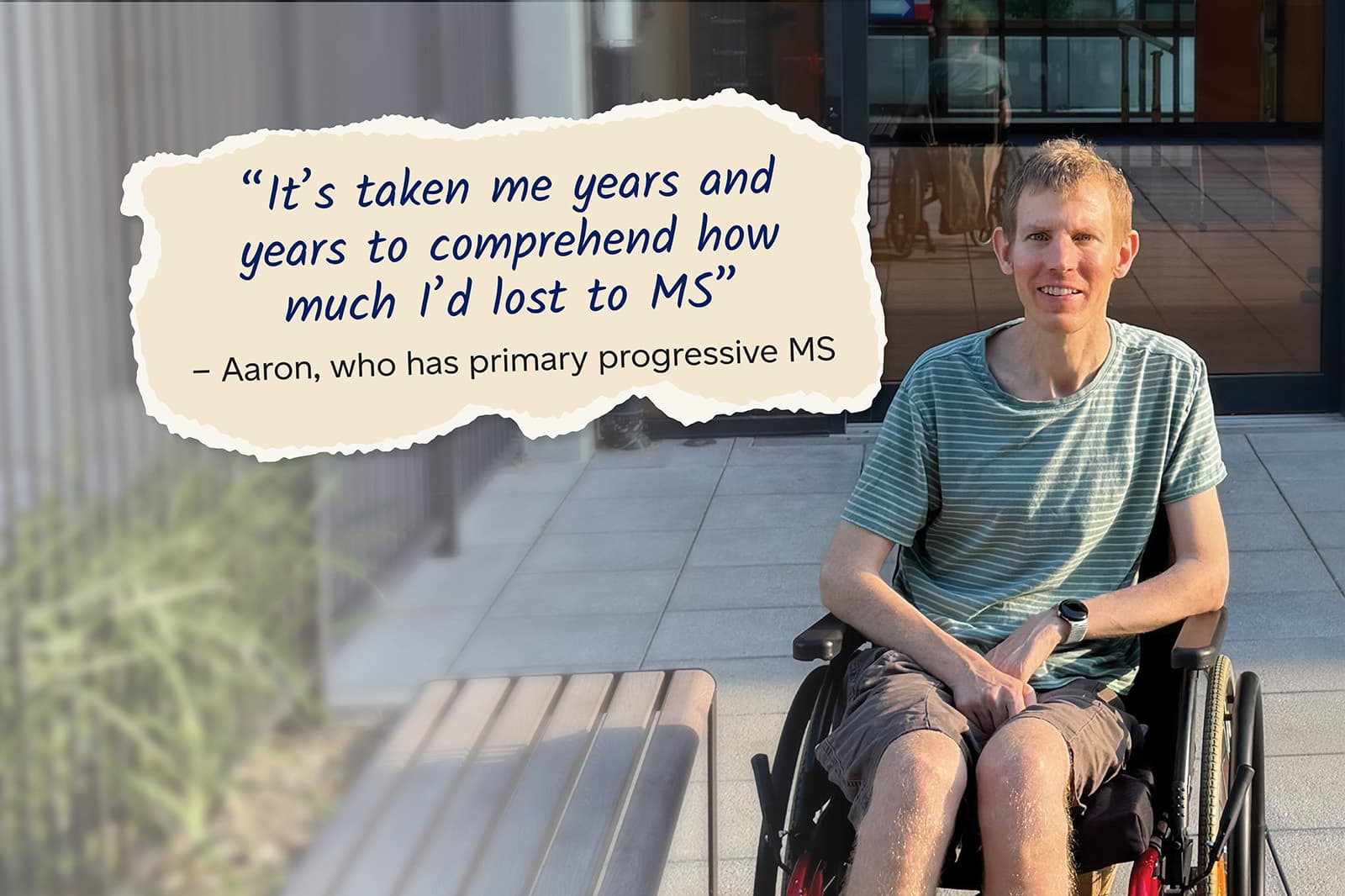 Aaron a client who is sitting in a wheelchair at Lidcombe home with a quote that says "Its taken me years and years to comprehend how much 'd lost to MS"