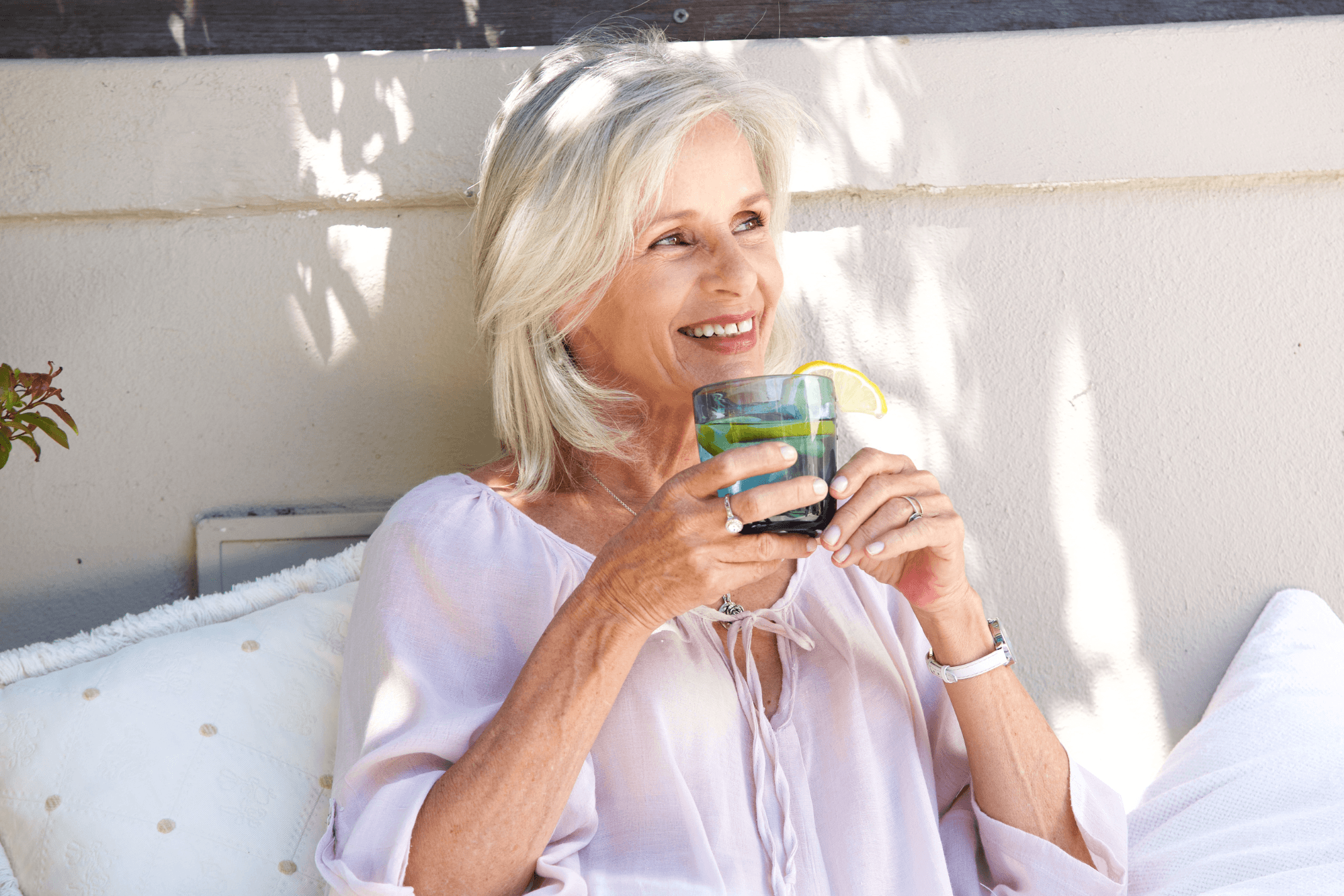 Older woman drinking water