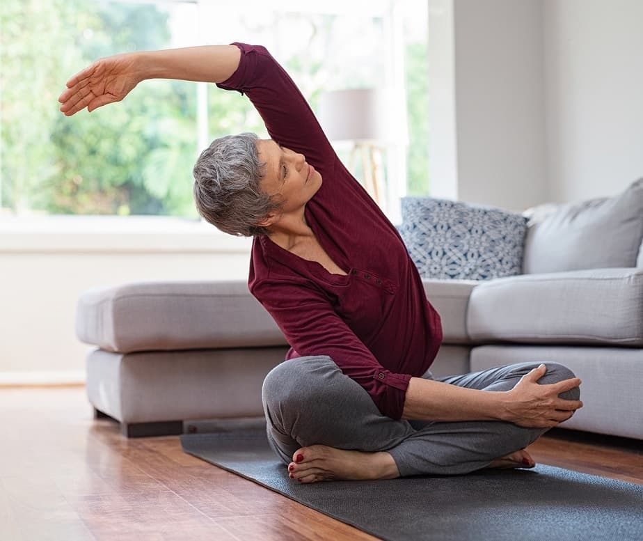 Bigstock fitness senior woman exercising stretching exercise mental health wellbeing 260538283