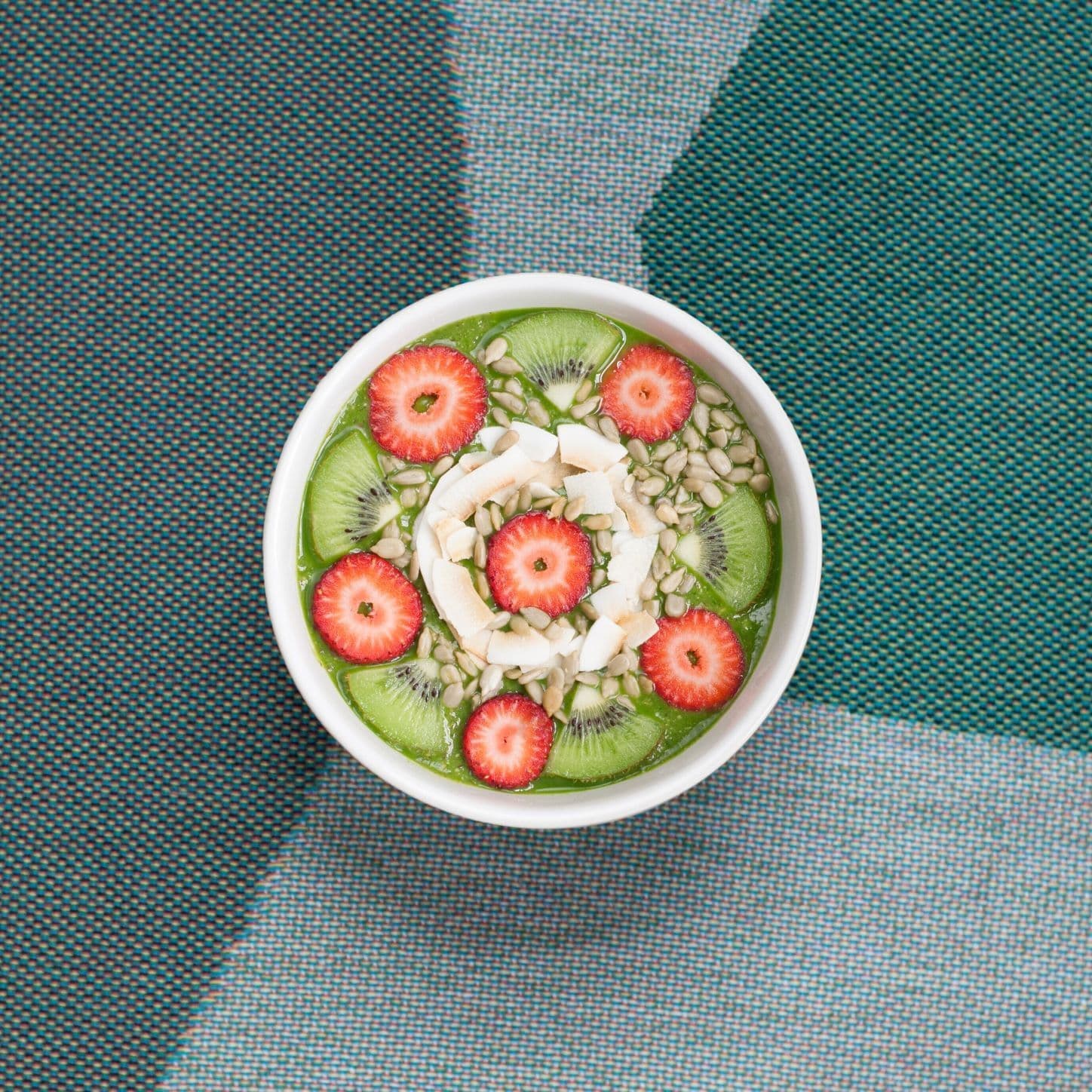 bowl of oats with kiwi and strawberries