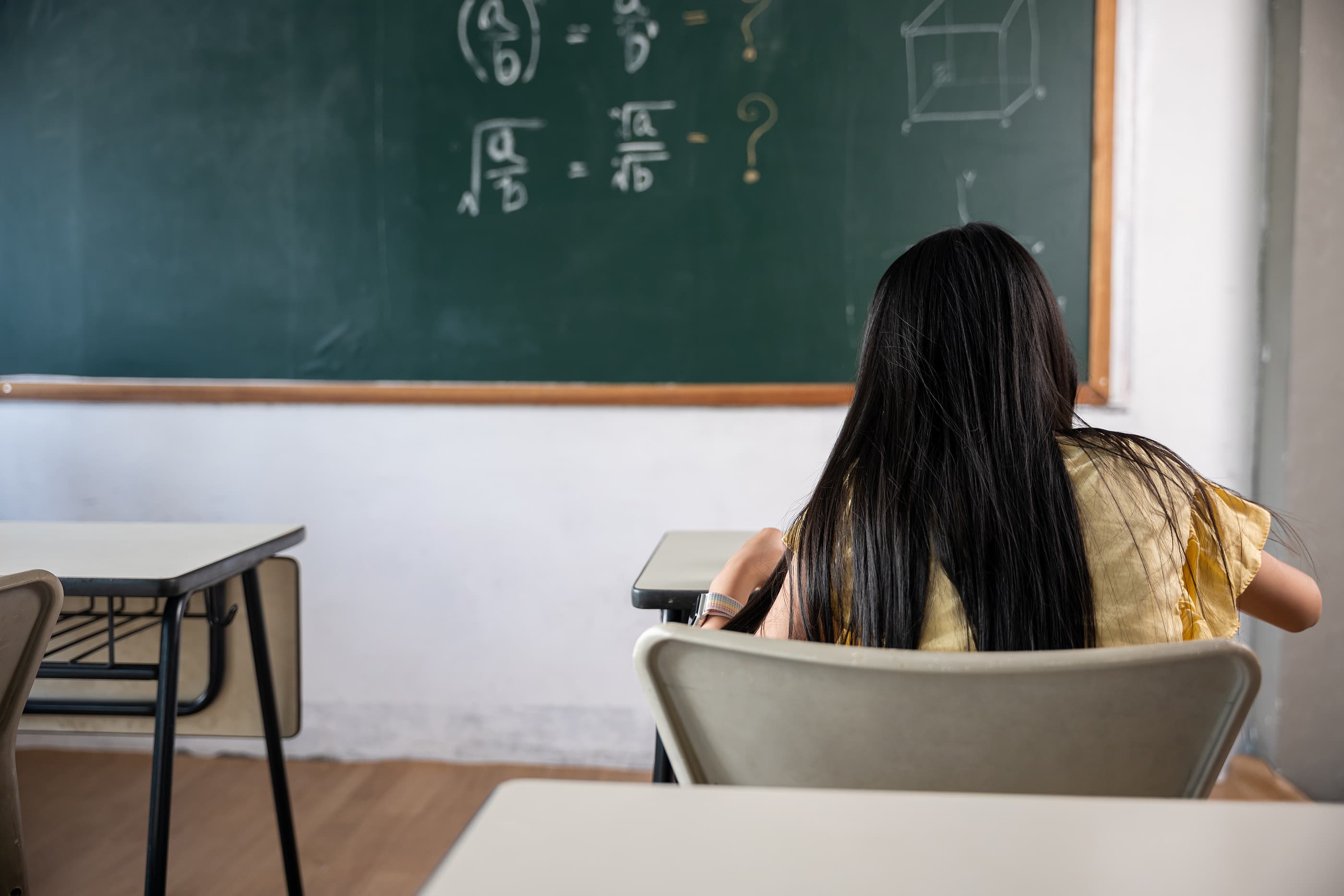 High school student sitting at a desk