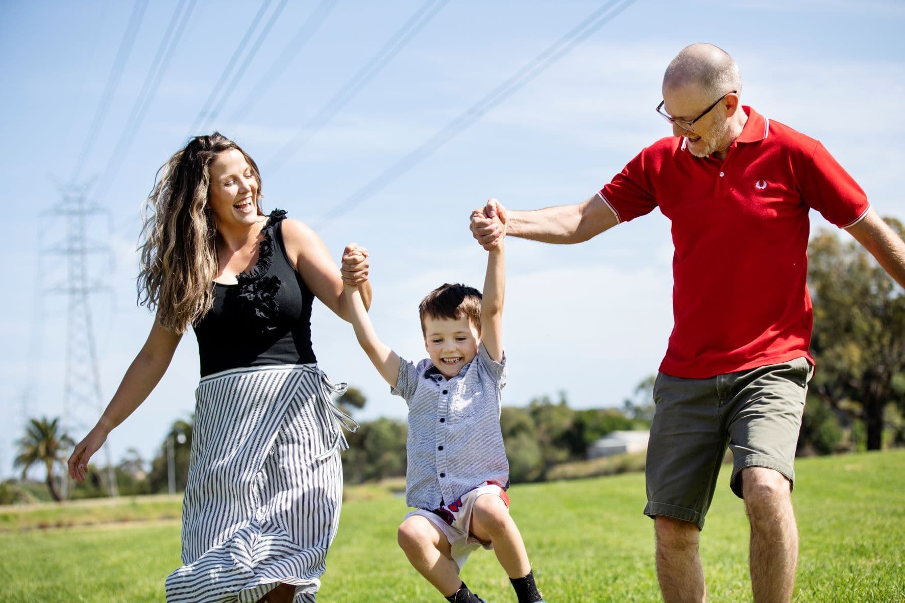 Young family playing outside
