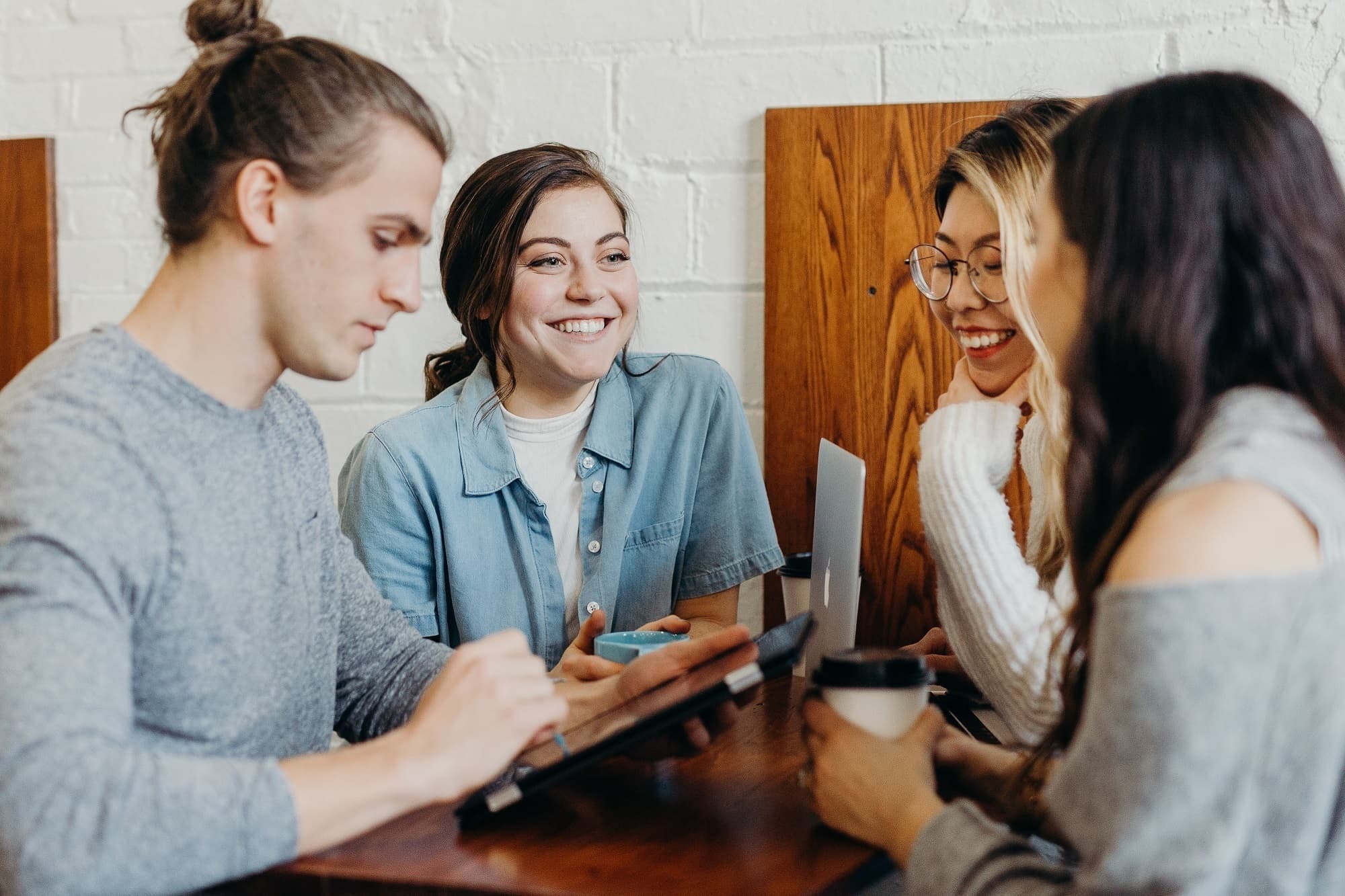 A group of people at table conversing