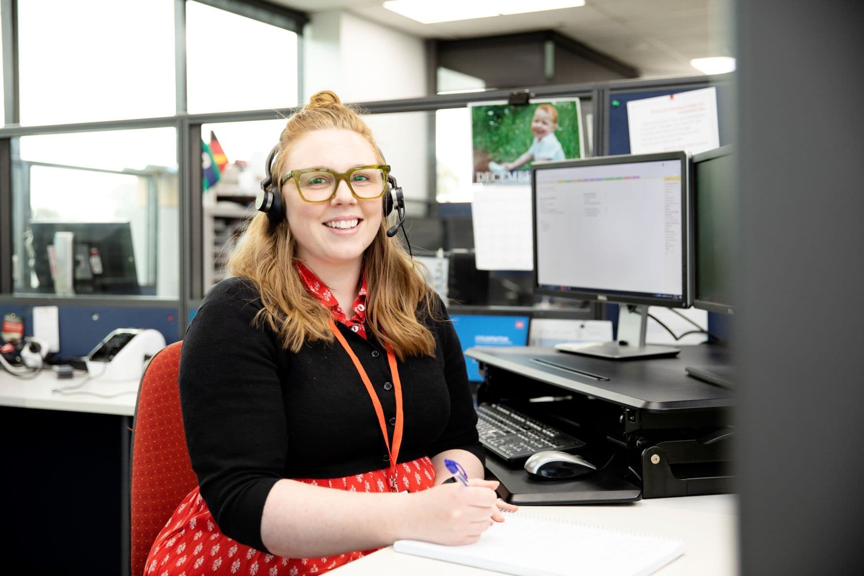 ms plus employee smiling on the phone