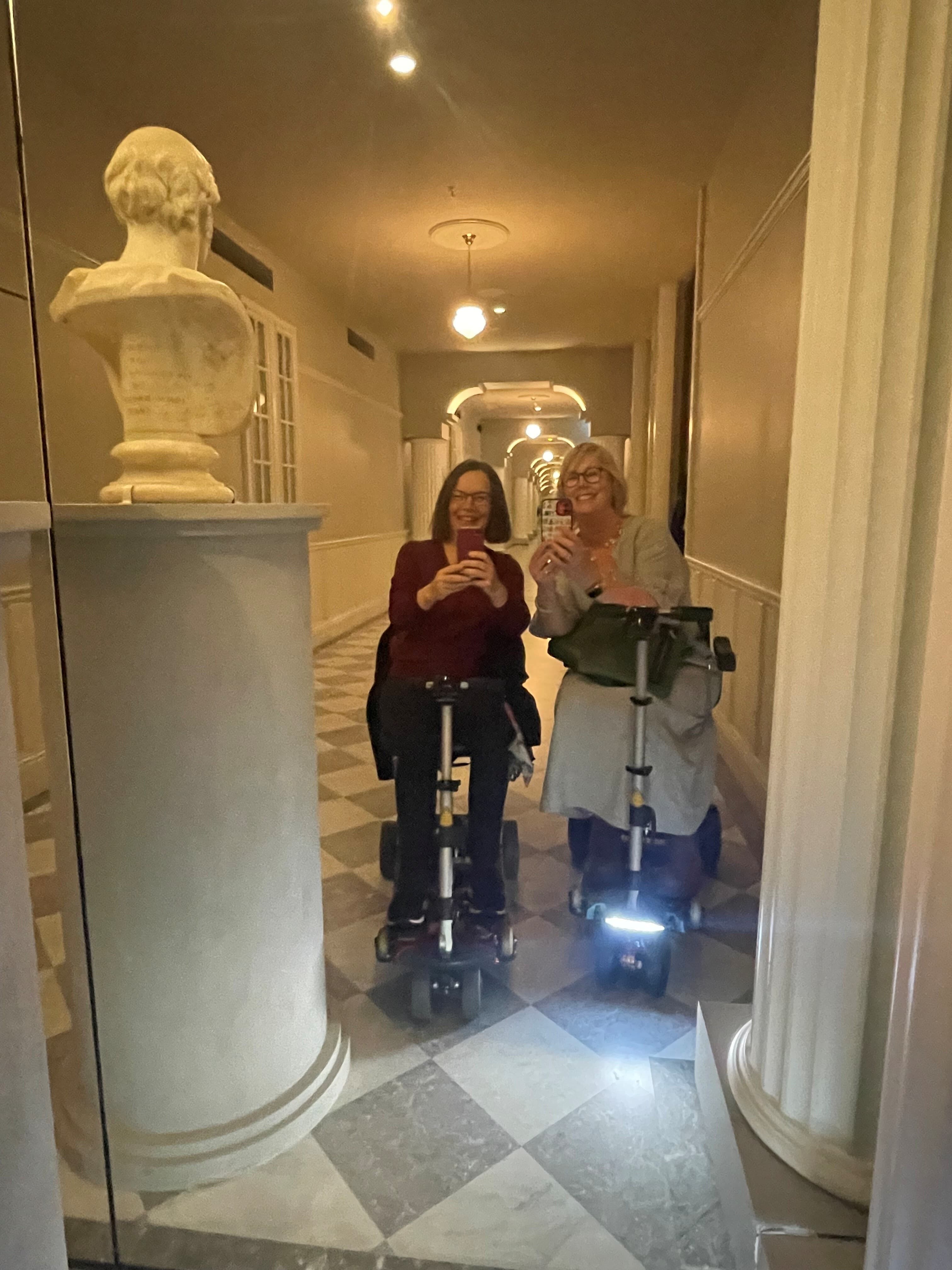Rosi (left) and Nicole (right) taking a mirror selfie on their trip to the National Gallery of Victoria