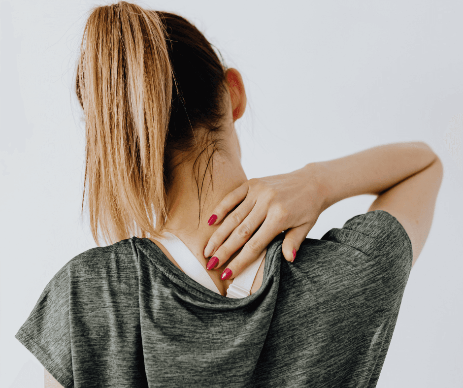 Person holding neck in pain